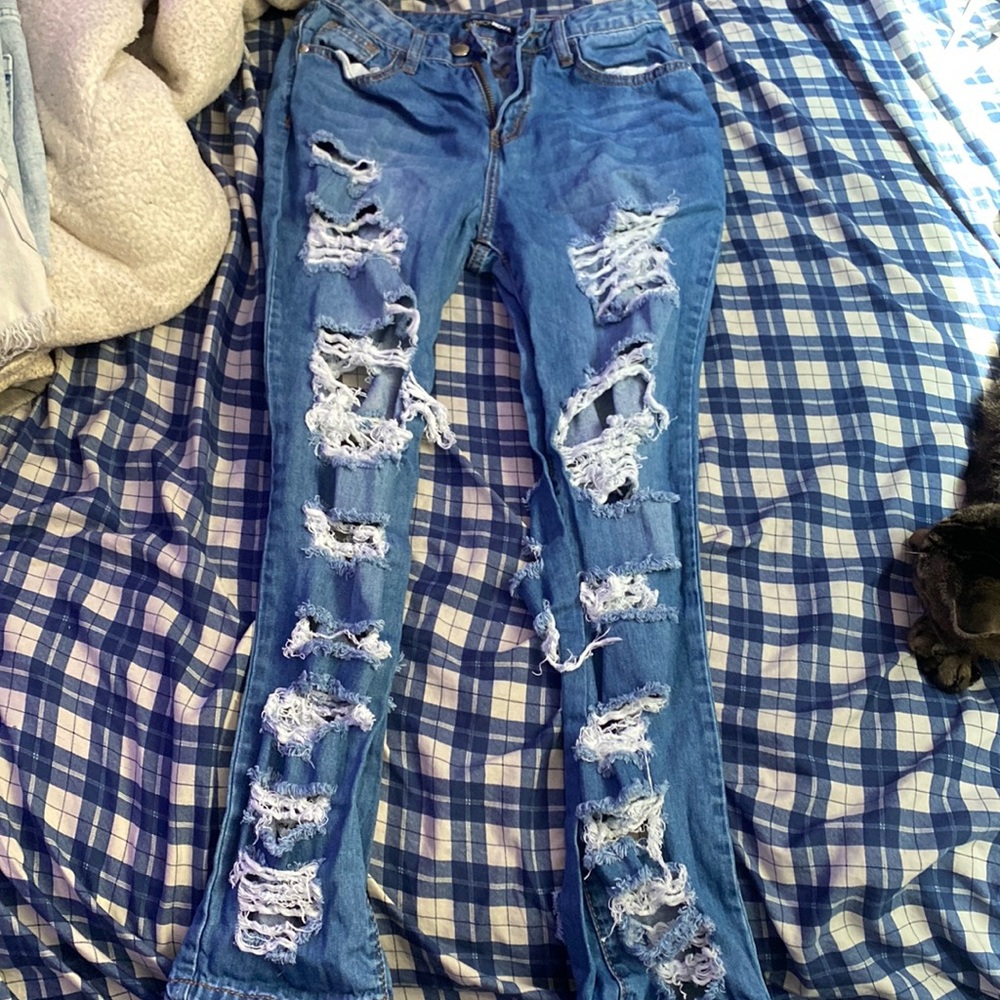 very ripped jeans